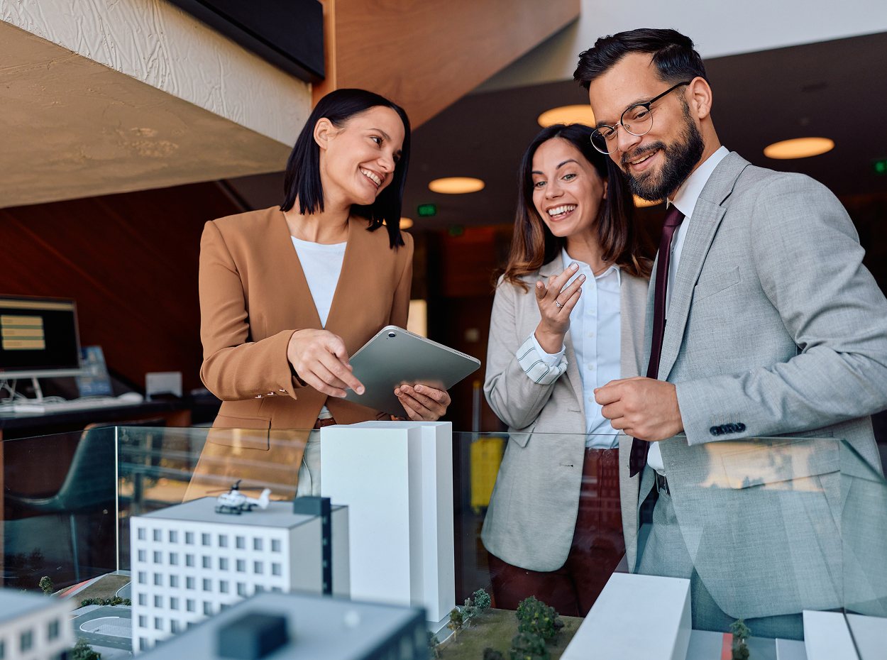 Centralized leasing operations image showing two people dscussing work